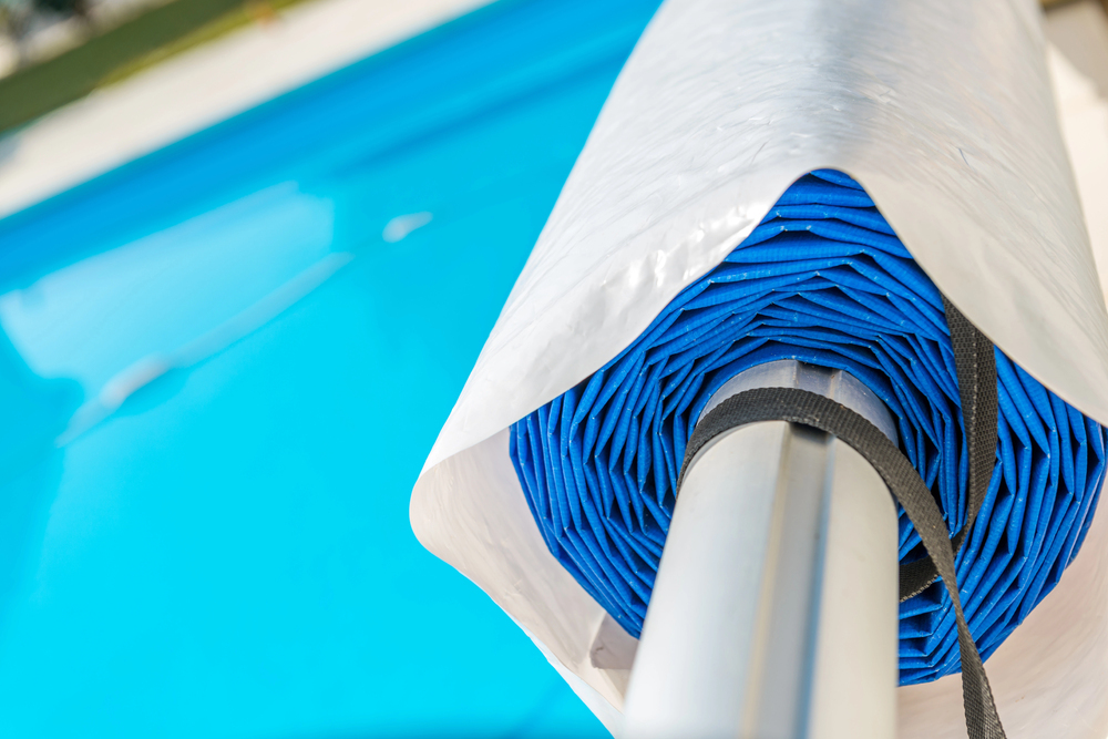 rolled up solver cover by pool