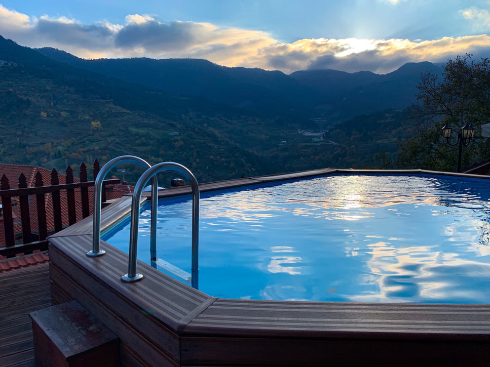 A hot tub with a view of some mountains