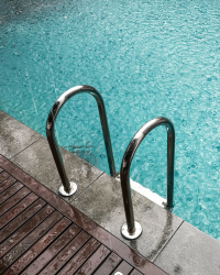 Rain falling on a flooded swimming pool