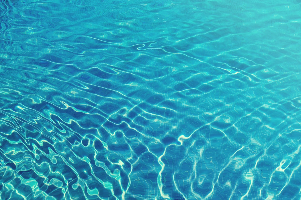 Ripples in clean blue swimming pool water