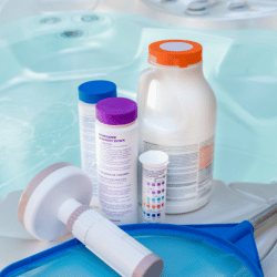 Hot tub chemicals on the side of a hot tub