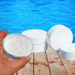 Someone putting a chlorine tablet in a pool