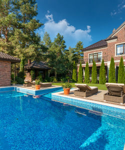 A swimming pool in the back garden of a property