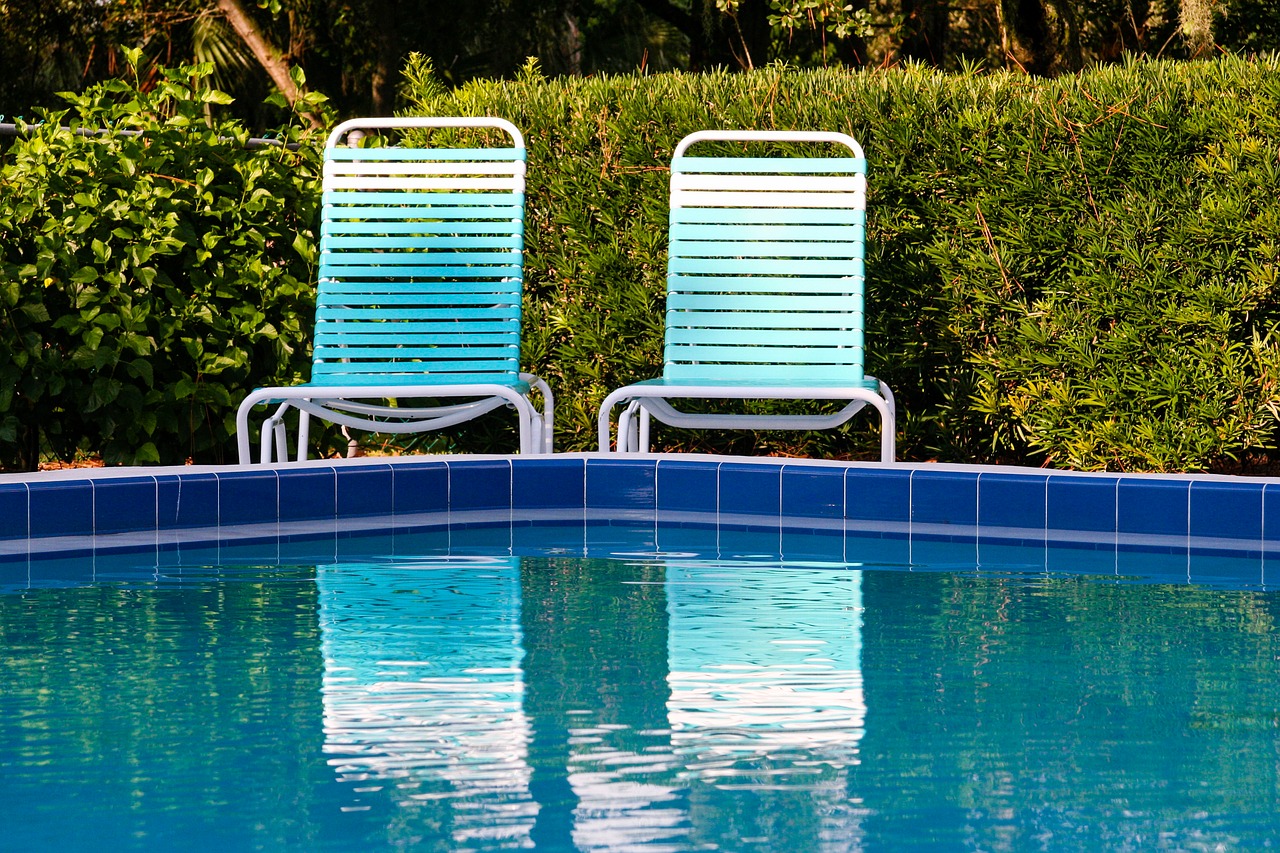 chairs next to a pool