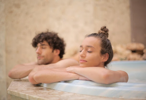Two people relaxing in a hot tub