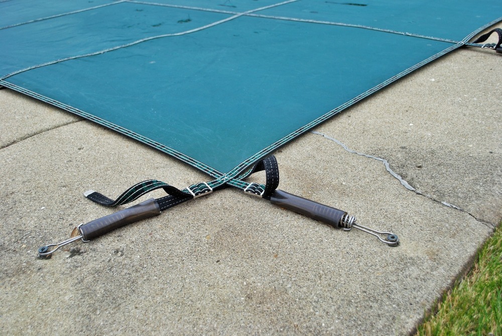 winter pool cover attached to patio